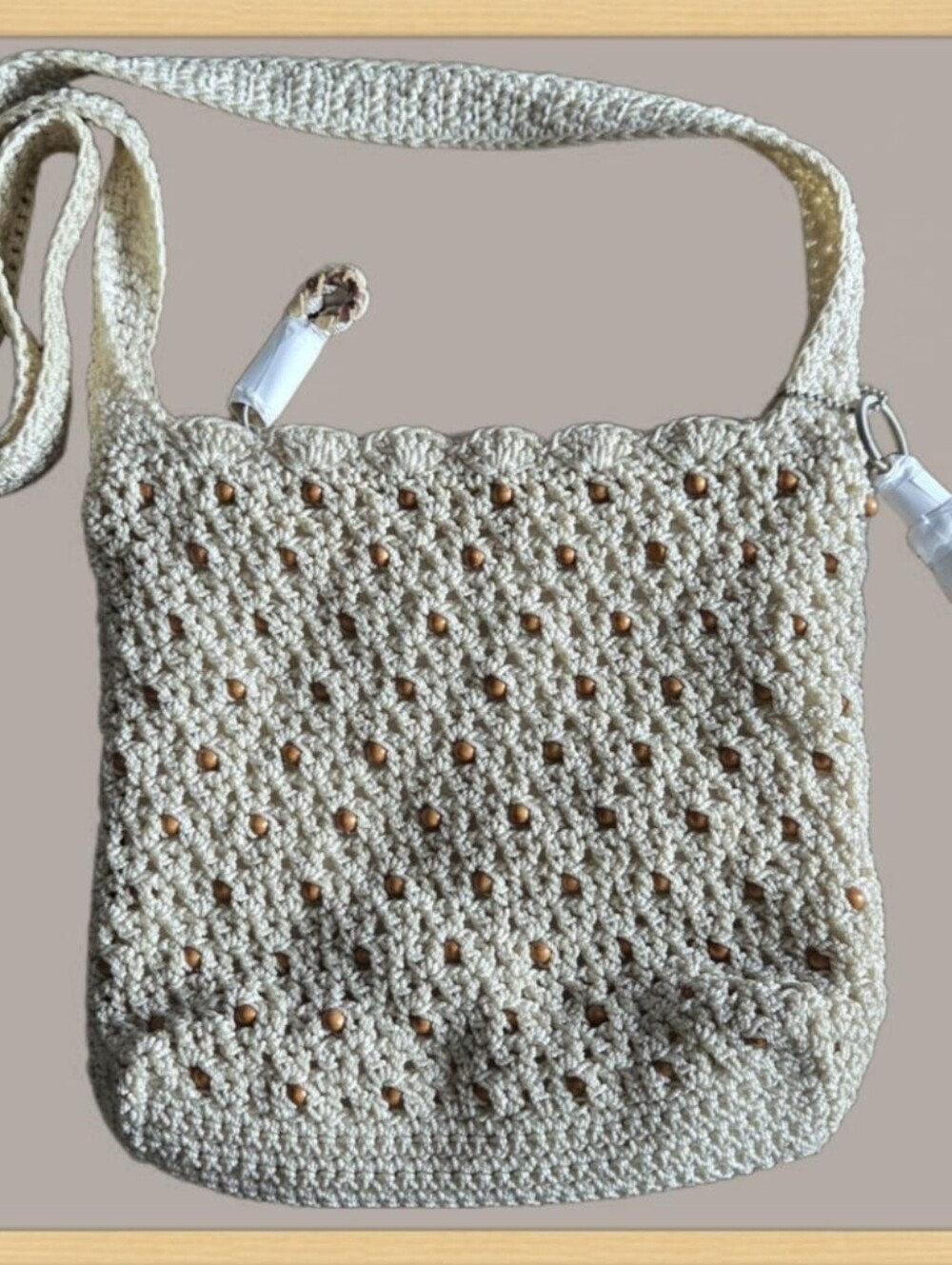 The Sak Crochet Shoulder Bag with Wood Beads & Tassel